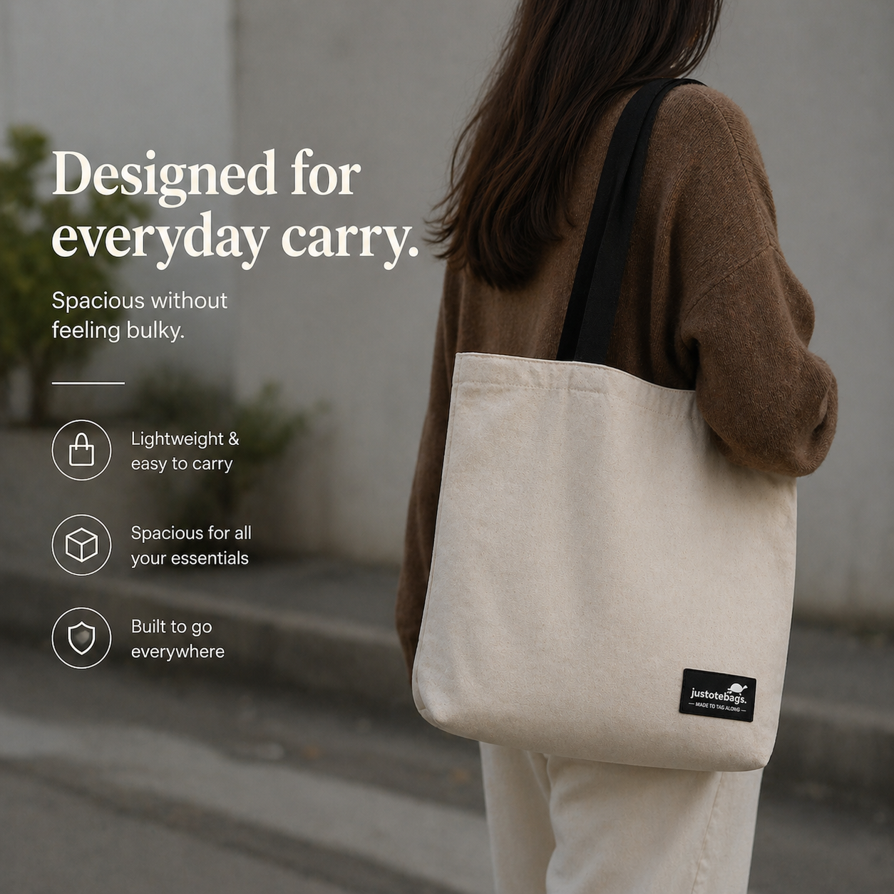 Person carrying a beige tote bag with text highlighting its features.