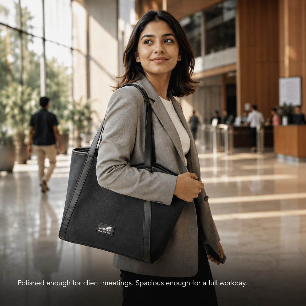 The Laurel Tote in Charcoal — interior view showing 15.6 inch laptop sleeve and zipped pocket