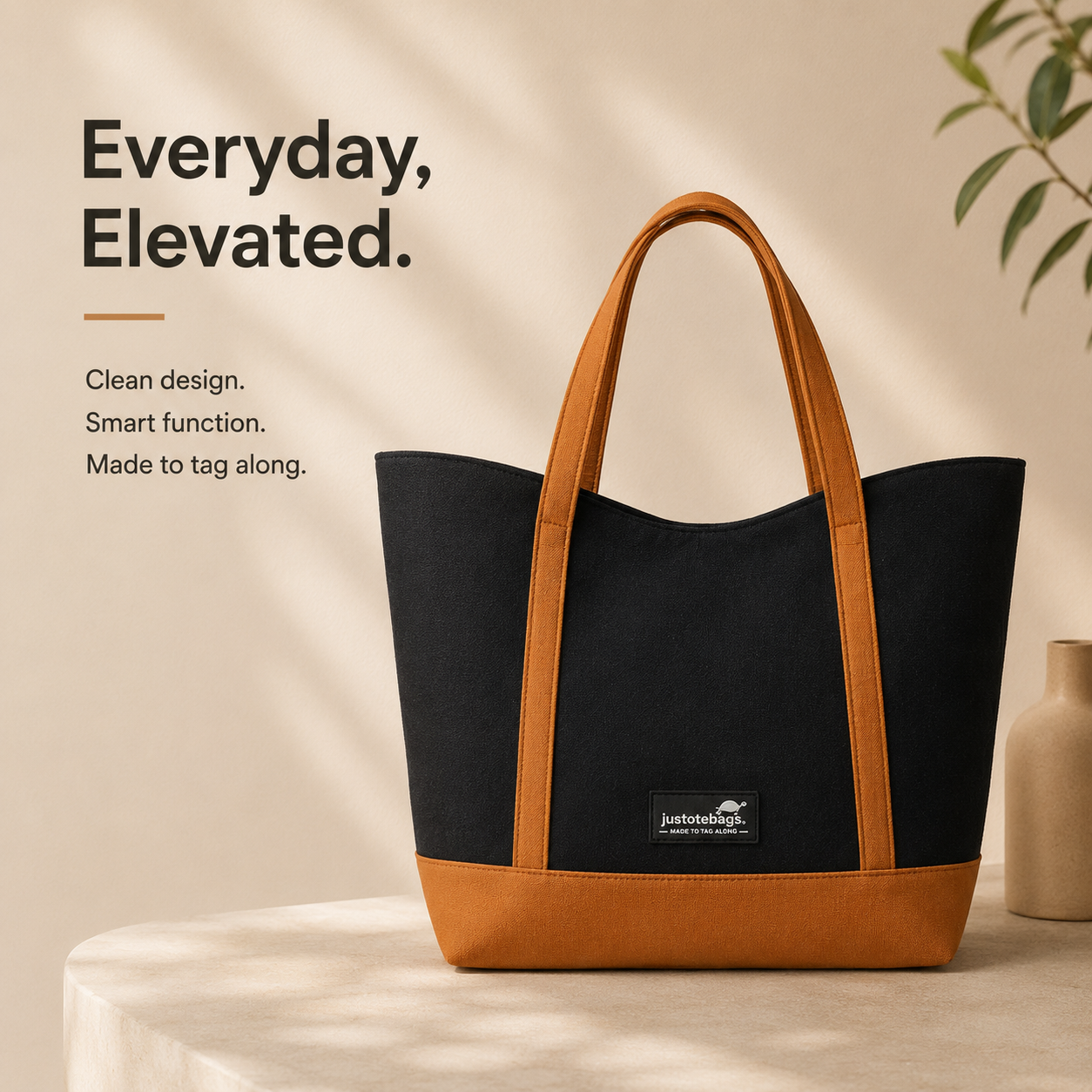 The Juniper Tote in Black/Brown by JustoteBags — premium two-tone tote bag with button closure